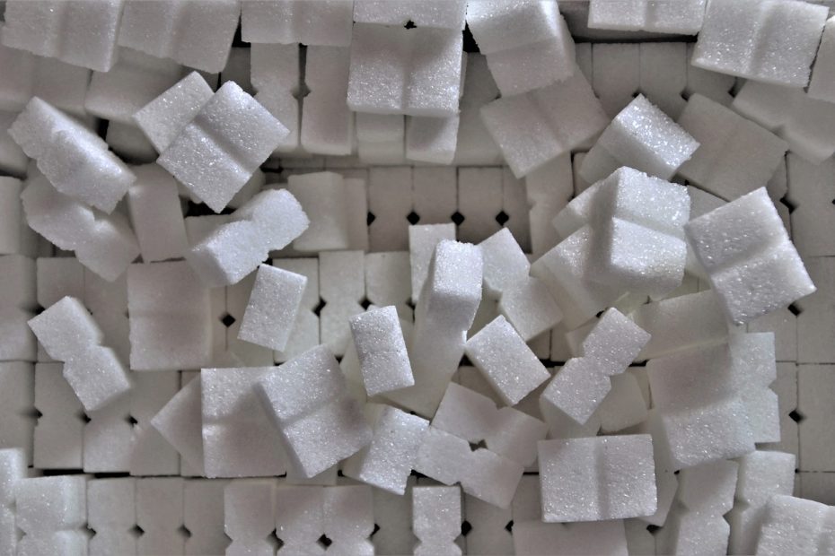 Fine white sugar cubes, perfect for baking and sweetening, on a clean background, symbolizing pure refined sugar quality
